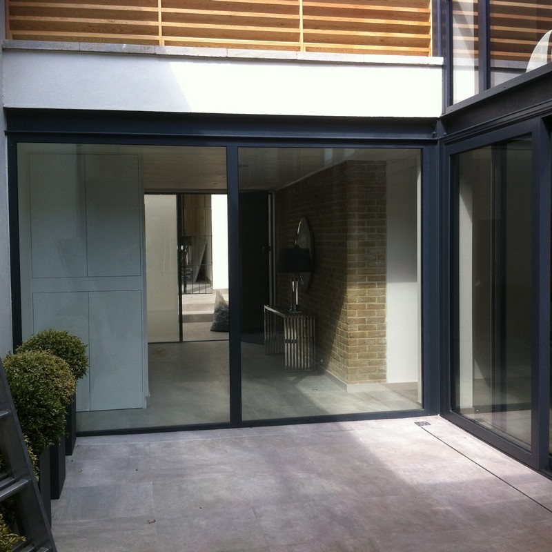Floor-to-ceiling sliding doors opening to courtyard in Elephant & Castle