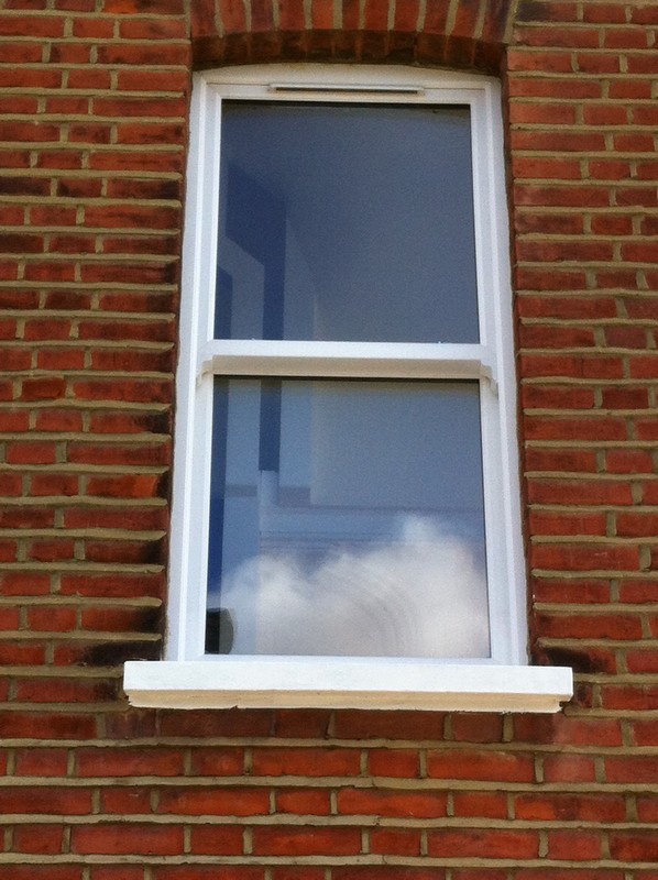 uPVC sash window on Victorian red brick house in Elephant & Castle